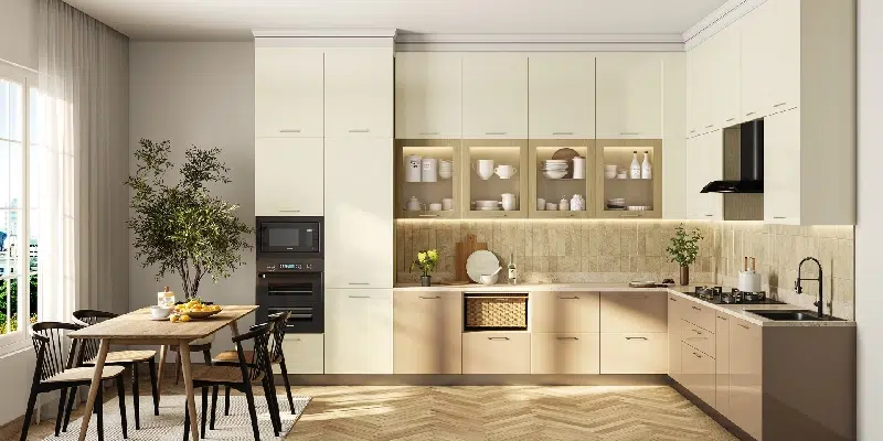 Modern modular kitchen with attached dining table, wooden cabinet doors, chimney space, microwave unit, and glass rack shutters reflecting interior work by Olangana Design’s in Bangalore.