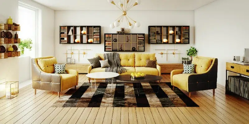 Ground floor living area with black sofas and garden view