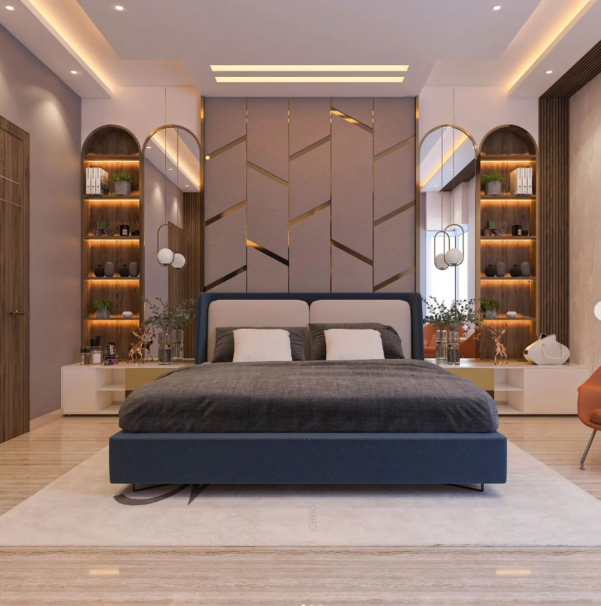 Luxury modern bedroom interior design by Olangana Design in Bangalore, featuring a stylish blue bed, geometric accent wall, and illuminated arched shelves.