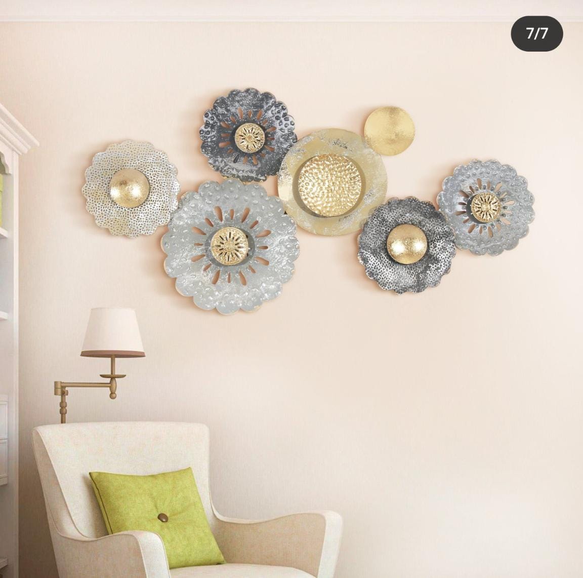 Elegant metallic floral wall art installation above a cozy armchair with a lime green cushion, showcasing sophisticated interior decor by Olangana Design in Bangalore.