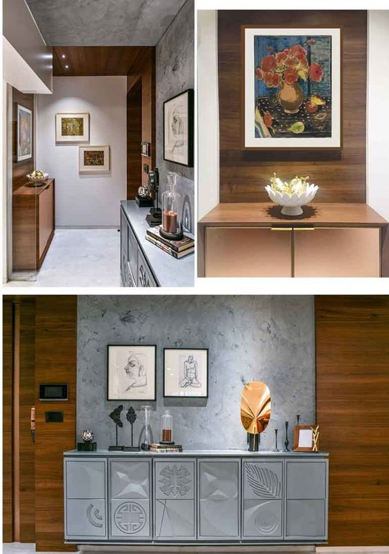 Modern interior design by Olangana Design in Bangalore featuring a sophisticated hallway with a concrete wall, elegant wooden paneling, decorative console tables, and framed artworks, showcasing refined residential interior solutions.