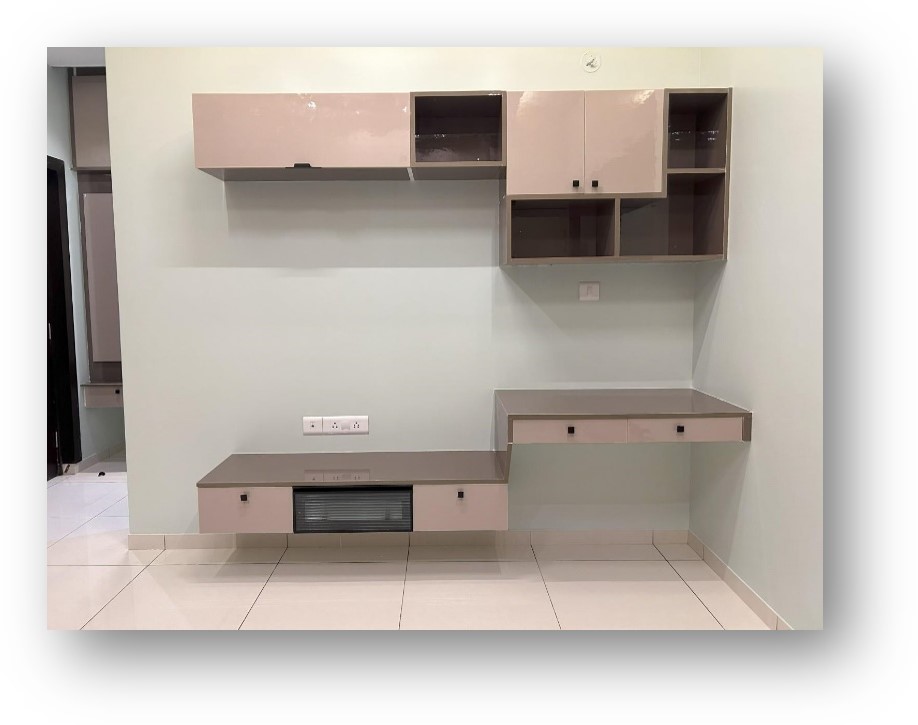 Modern floating wall unit with glossy beige cabinets, open shelves, and an integrated study desk, expertly designed for contemporary interior spaces by Olangana Design in Bangalore.