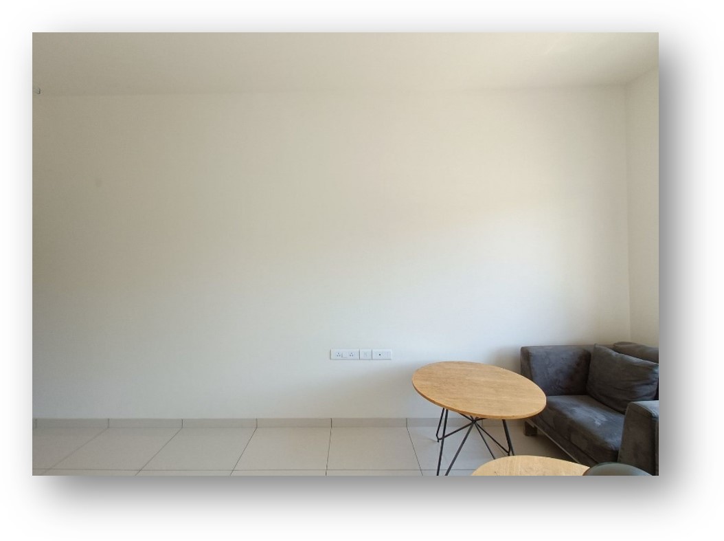 Empty room with pristine white walls and tiled floor, awaiting a bespoke interior design transformation by Olangana Design in Bangalore.