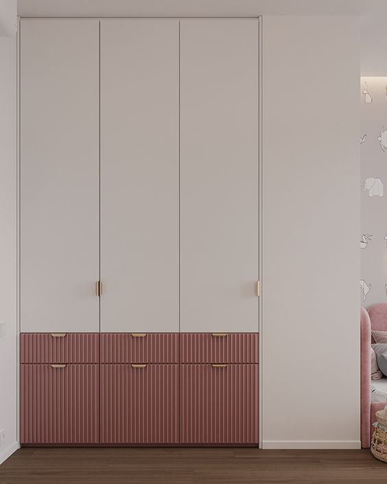 Elegant bedroom interior design by Olangana in Bangalore, showcasing custom built-in wardrobes with light neutral upper cabinets and textured dusty rose lower drawers.