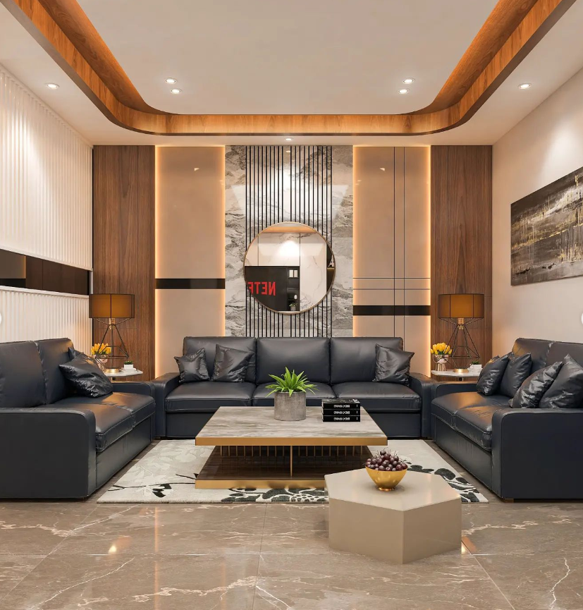 Luxurious modern living room interior design by Olangana in Bangalore, featuring dark leather sofas, a marble coffee table, warm wood paneling, elegant accent lighting, and a striking round mirror.