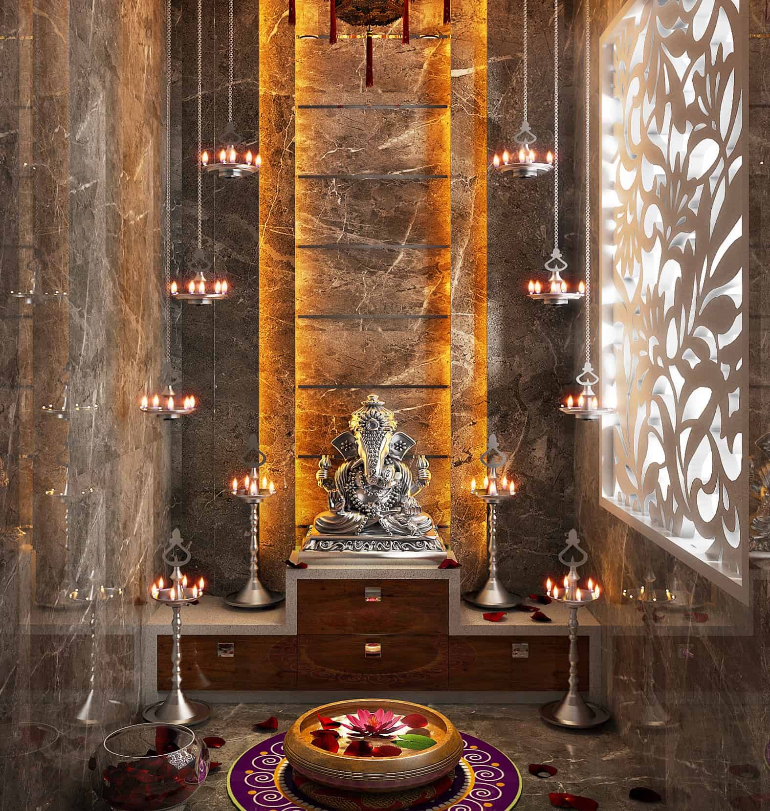 Luxurious Pooja room interior design by Olangana in Bangalore, featuring a silver Ganesha idol, marble wall cladding with warm backlighting, and traditional hanging and standing oil lamps.