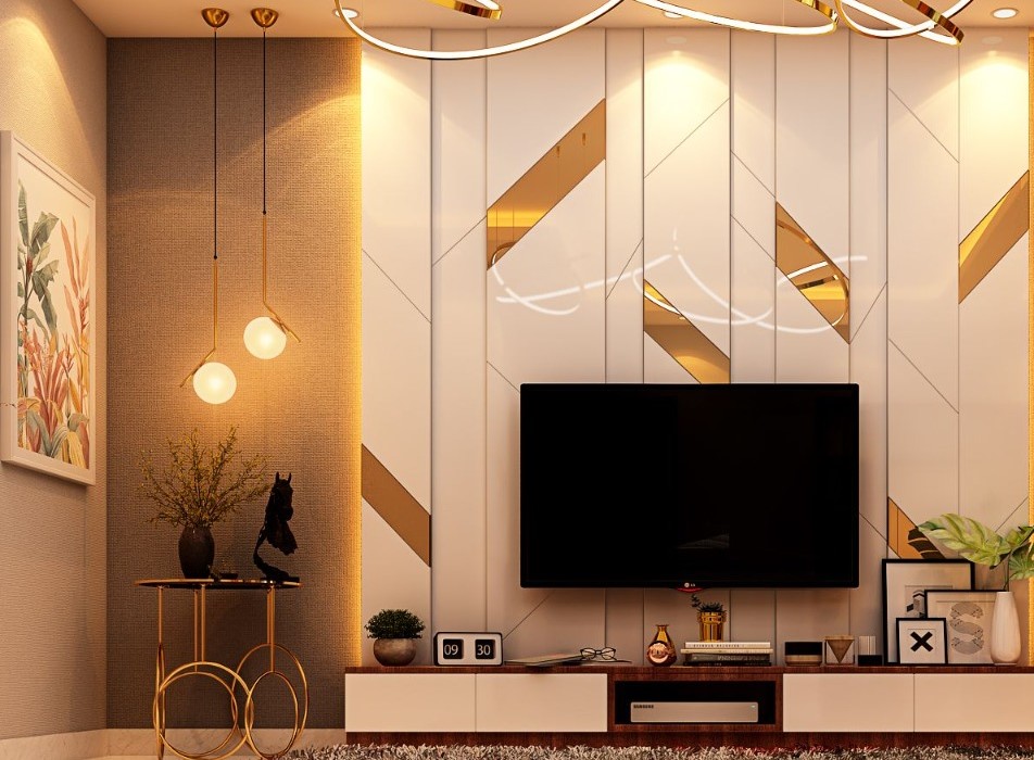 Elegant modern living room interior design by Olangana in Bangalore, featuring a sleek TV unit with a striking white and gold geometric accent wall, complemented by warm LED lighting and stylish spherical pendant lamps.