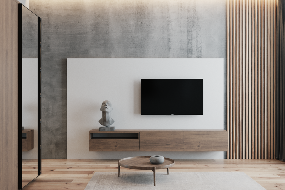 Elegant minimalist living room interior design by Olangana, featuring a floating wooden media console, a television mounted on a crisp white panel, and a raw concrete accent wall. Warm wooden slats and light oak flooring complete this sophisticated Bangalore interior design.