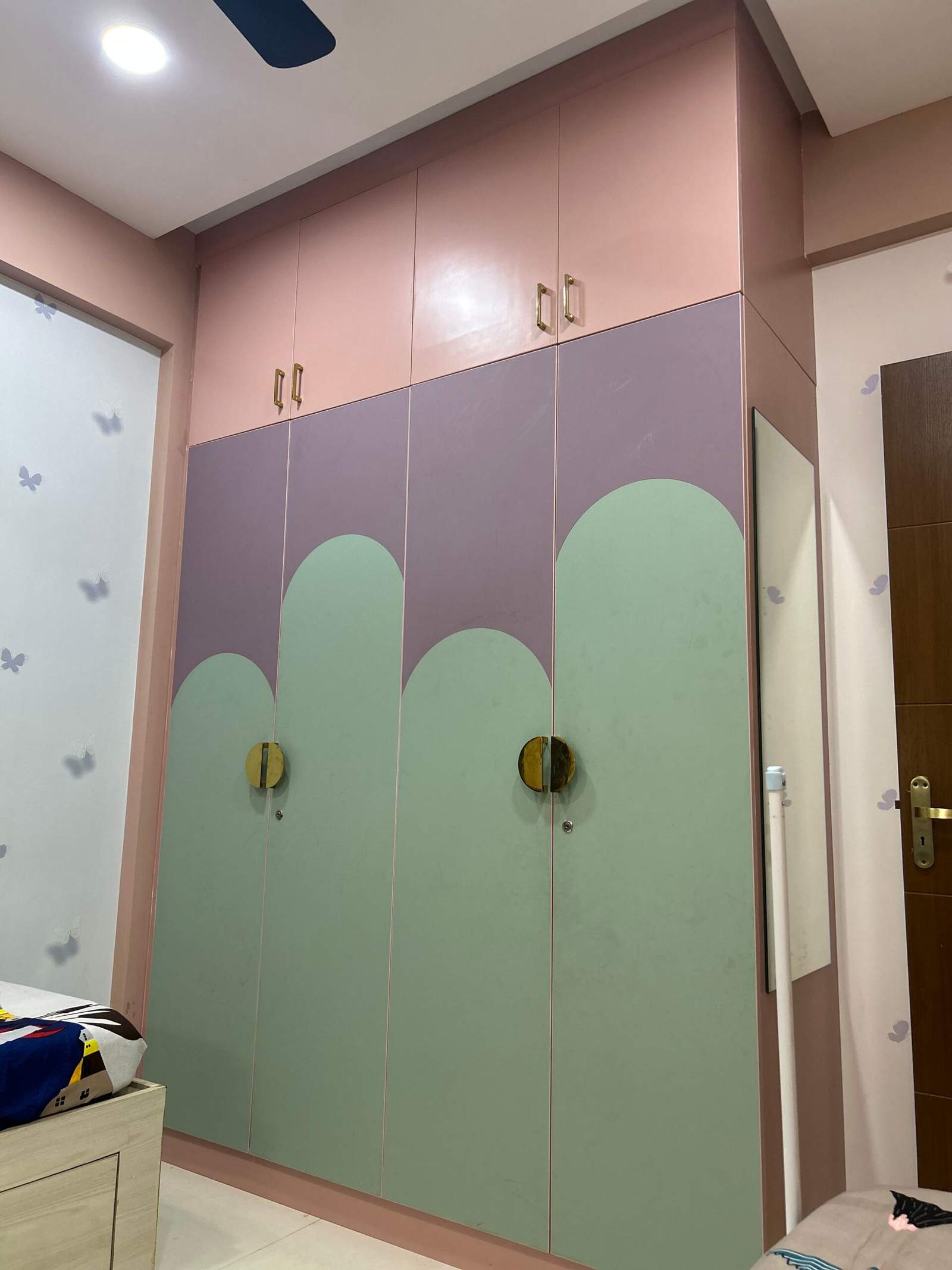 Olangana Design’s children’s bedroom interior with sliding wardrobe and under-bed drawer storage.