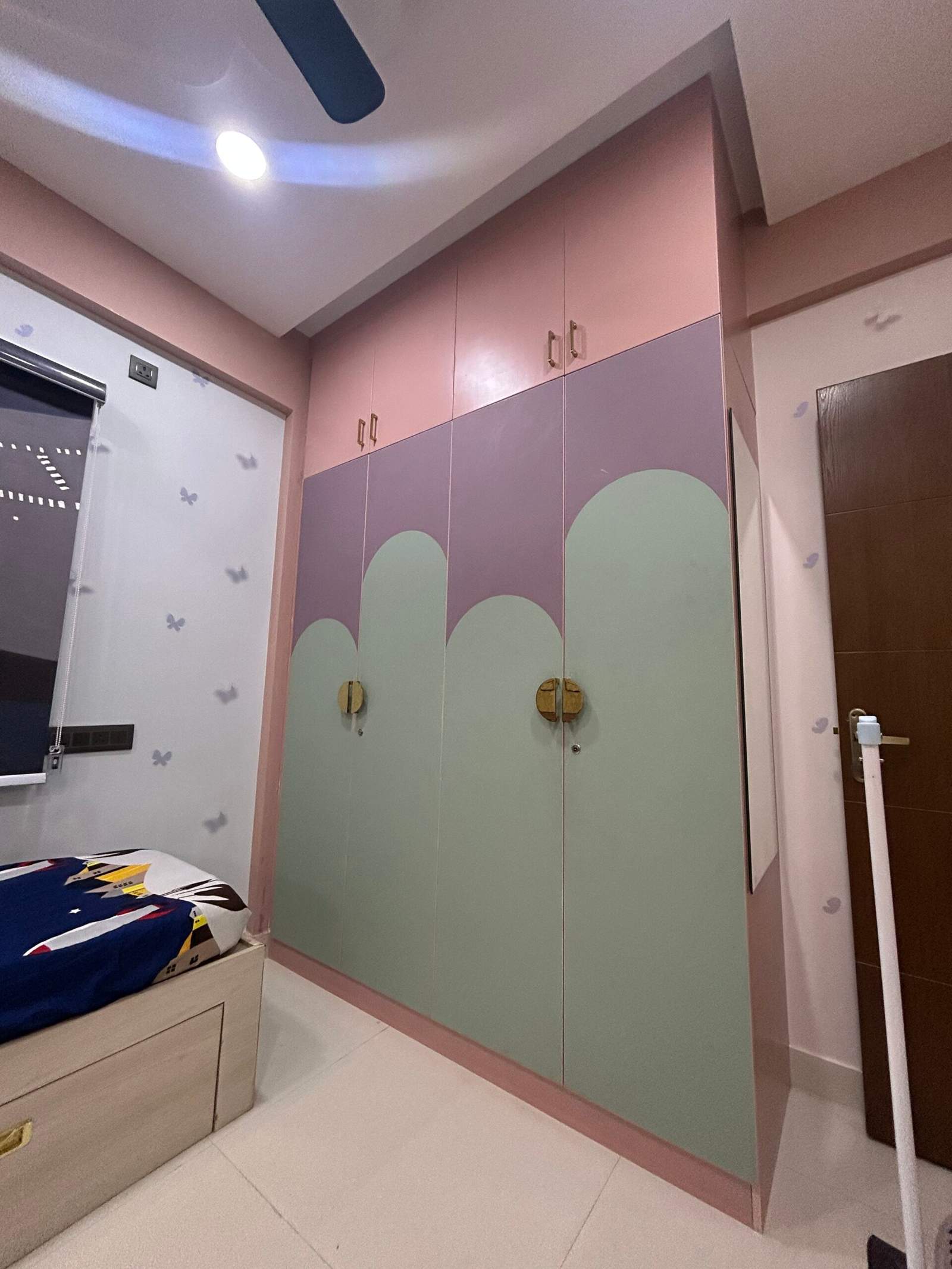 Children’s bedroom with sliding wardrobe and storage beds in a Bangalore home designed by Olangana Design’s.