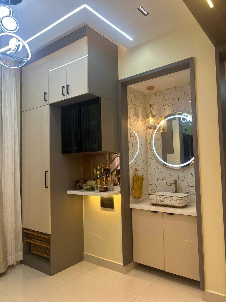 Modern hand wash basin near dining space with storage cabinets in Bangalore by Olangana Design’s.